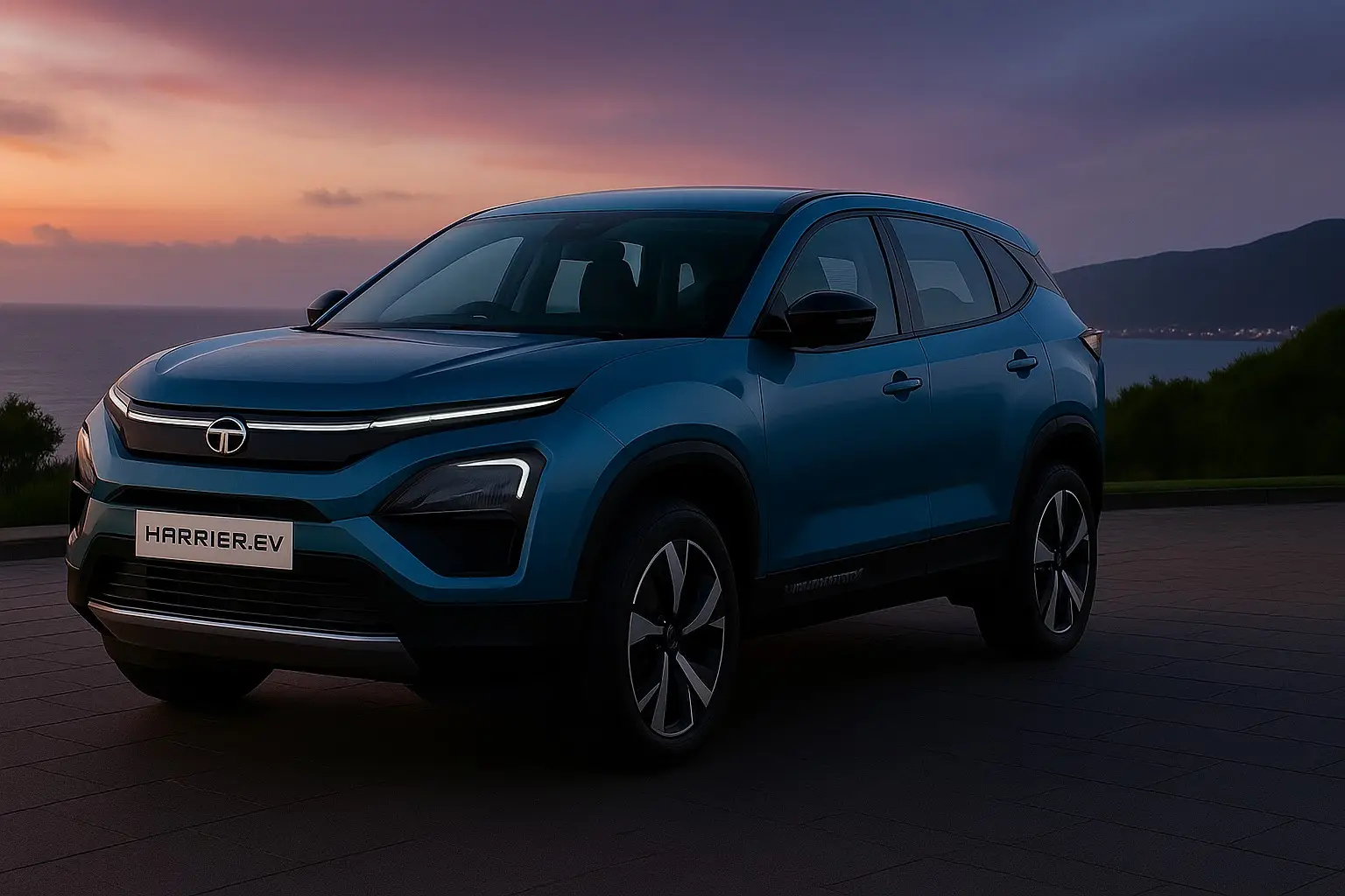 Blue Tata Harrier EV at sunset by the coast.